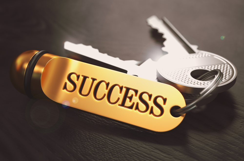Keys to Success - Concept on Golden Keychain over Black Wooden Background. Closeup View, Selective Focus, 3D Render. Toned Image.